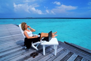 woman-on-a-beach-chair-holding-a-cellphone