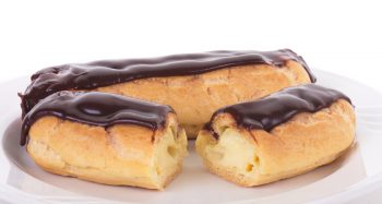Two Eclairs on White Plate