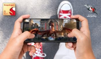 Cropped Hands Of Woman Using Mobile Phone Against White Background